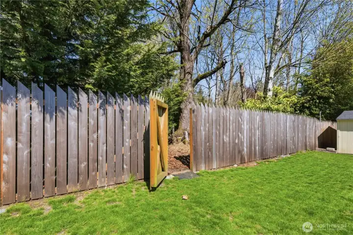 Back gate with private access to acres of walking trails.