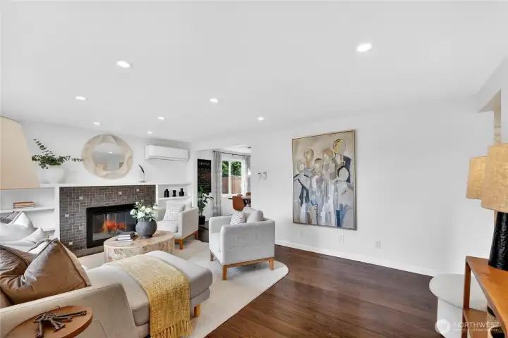 Spacious living room centered around the wood burning fireplace.