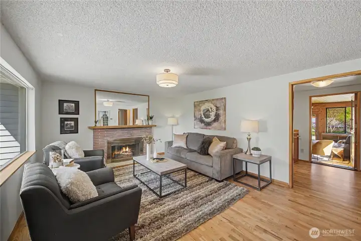 Welcoming Living Room with kitchen and bonus room beyond.