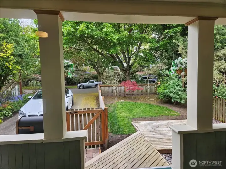 Front porch with treed front yard