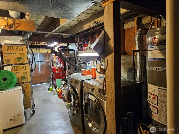 Garage with new hot water tank. Wash and dryer conveys.
