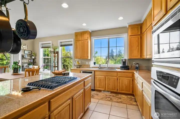 Kitchen offers you that gourmet feel with island cook top and stainless steel appliances