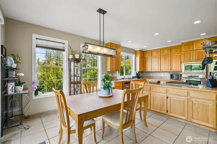 oversized eating are in the kitchen with a slider to the back yard