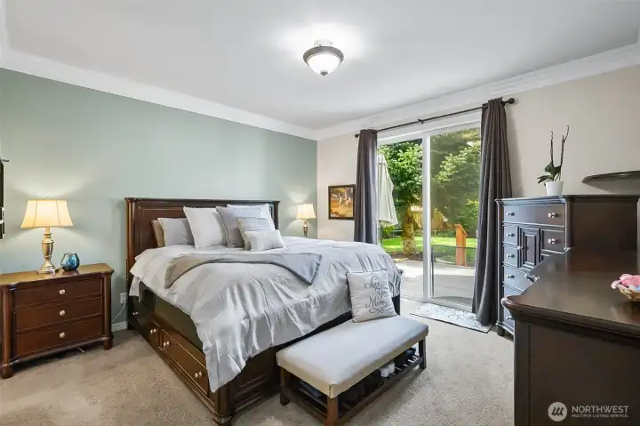 Primary on the main- features french doors and a slider to the backyard! and your private deck