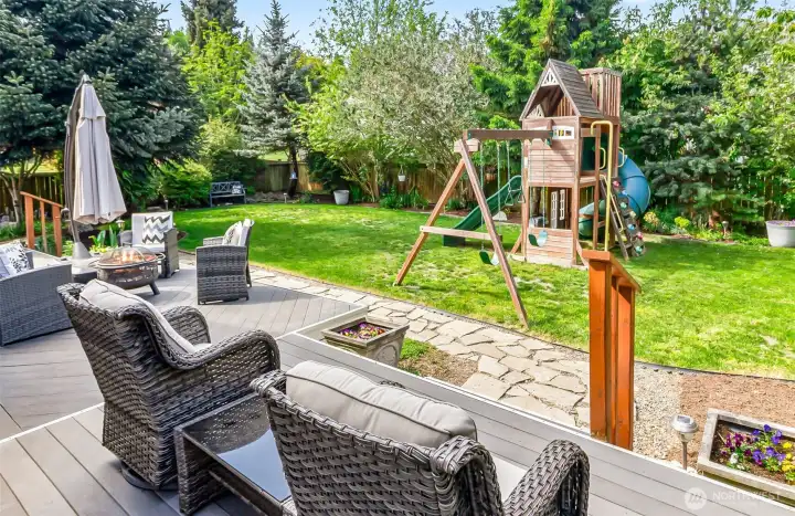 entertaining sized TREX deck and wonderful space to enjoy the mature landscaping of this fully fenced backyard.