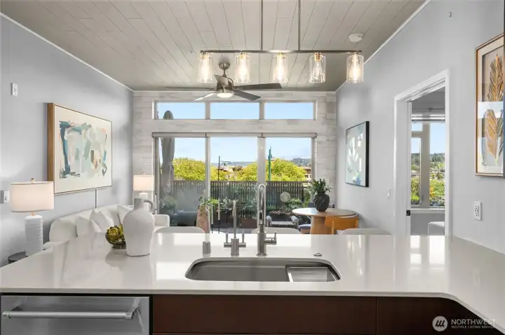 Gorgeous kitchen with modern finishes, 6-burner gas stove, glass tile backsplash, quartz countertops and eating bar. Notice the custom accent tile on the end of the countertop and the ceilings! Gorgeous kitchen with modern finishes, 6-burner gas stove, glass tile backsplash, quartz countertops and eating bar. Notice the custom accent tile on the end of the countertop and the ceilings!