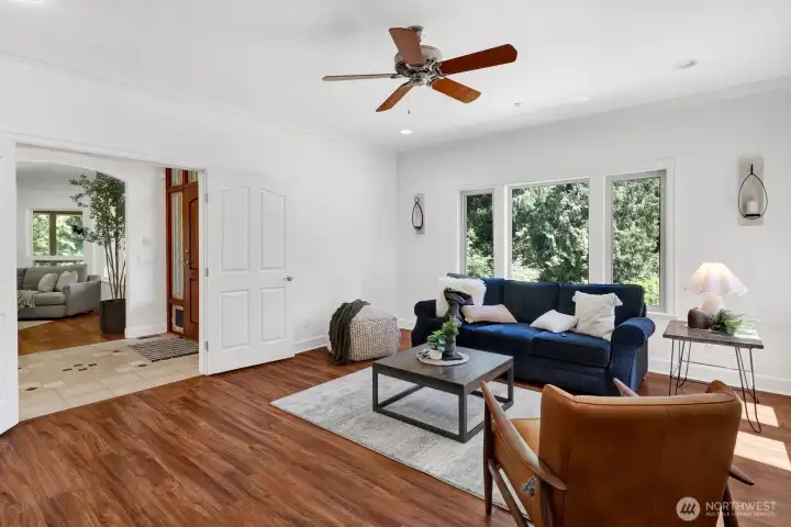 Adjacent to the entry way is a large den Adjacent to the entry way is a large den