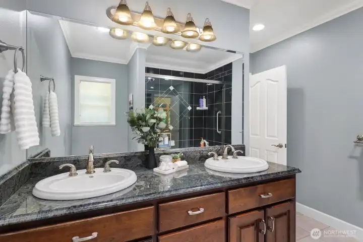 Upstairs full bathroom features double sinks Upstairs full bathroom features double sinks