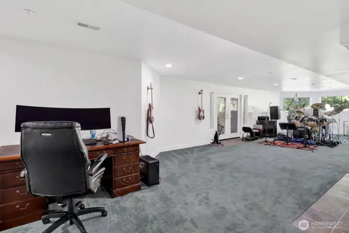 Downstairs in the walk-out basement find a HUGE family room with access to the yard and covered hot-tub Downstairs in the walk-out basement find a HUGE family room with access to the yard and covered hot-tub