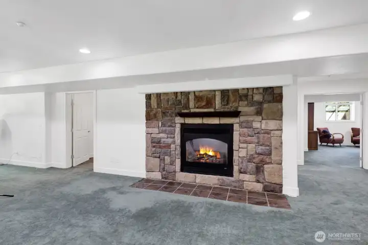 The downstairs features a cozy gas fireplace The downstairs features a cozy gas fireplace