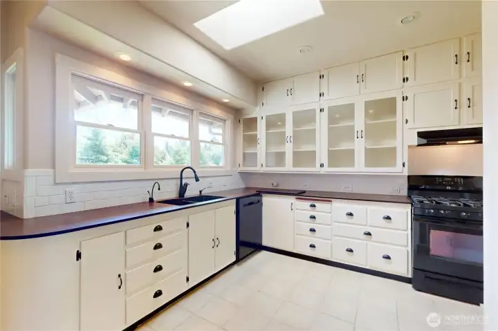 With an abundance of windows, canned lighting and a skylight, you will enjoy cooking in this bright kitchen! Locally made PaperStone countertops. With an abundance of windows, canned lighting and a skylight, you will enjoy cooking in this bright kitchen! Locally made PaperStone countertops.
