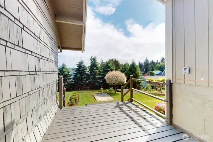 This portion of deck separates the home from the garage. Head down the stairs to the back yard. I LOVE the tree! This portion of deck separates the home from the garage. Head down the stairs to the back yard. I LOVE the tree!