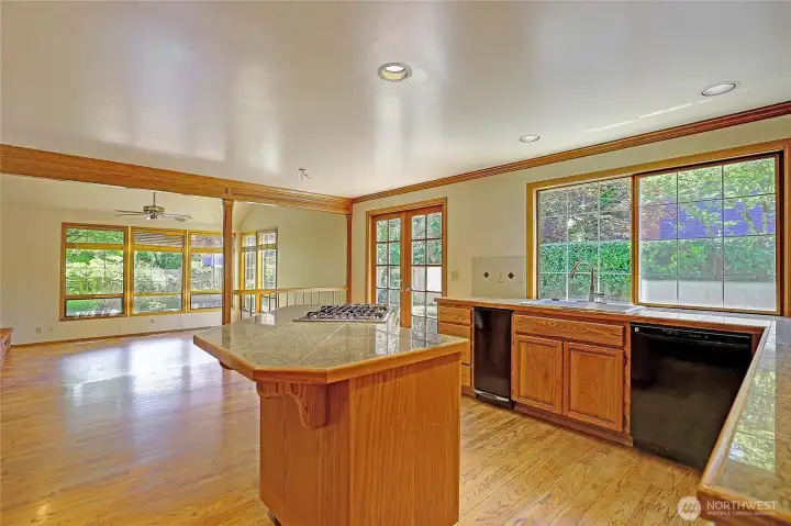 Center island with gas range updated granite tile counter tops