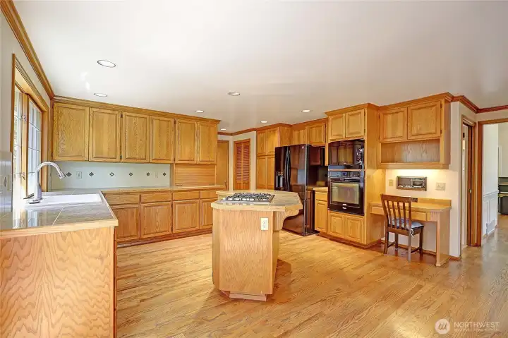Built in desk and tons of cupboard space and 2 pantries!