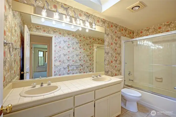 Main bathroom featuring dual vanity