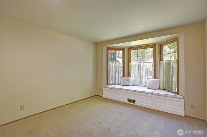 Bedroom 1 with built in window seat and extra storage, freshly painted!