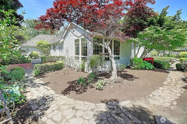 beautiful English gardens throughout the back yard, with mature trees