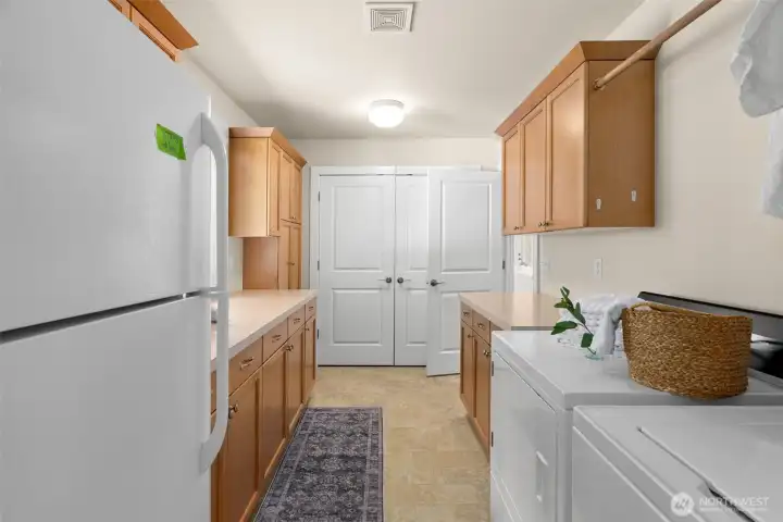 Laundry room is Huge! lots of cabinet space, counter area and even room for a second refrigerator