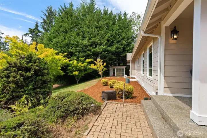 Side yard walkway on the left of the home