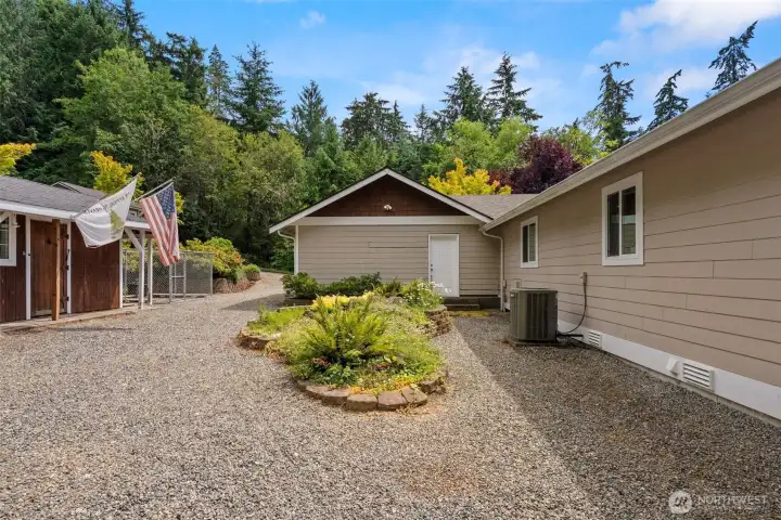 View of the side yard/back yard.  Easy to maintain, its all gravel