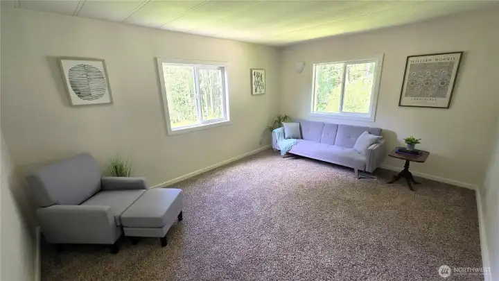 Spacious main bedroom boasts new carpet, pad, windows and paint
