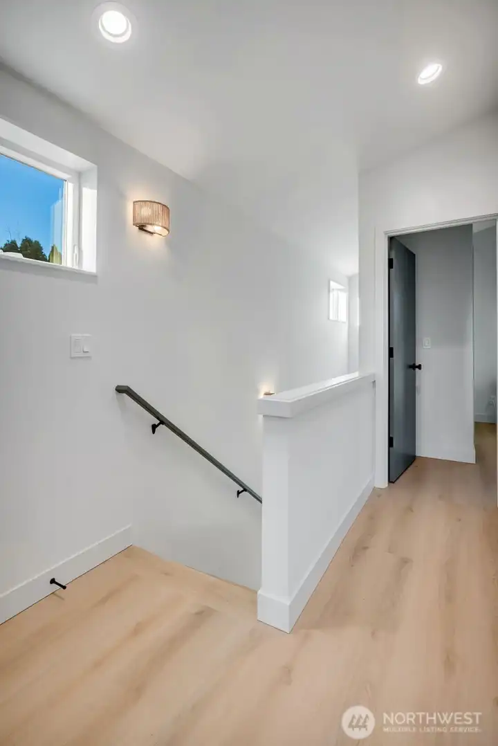 The second level has two bedrooms, both with ensuite bathrooms and high ceilings.