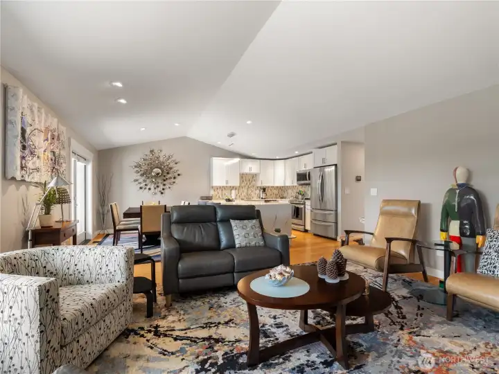 The transition from living room to dining room to kitchen is seamless.