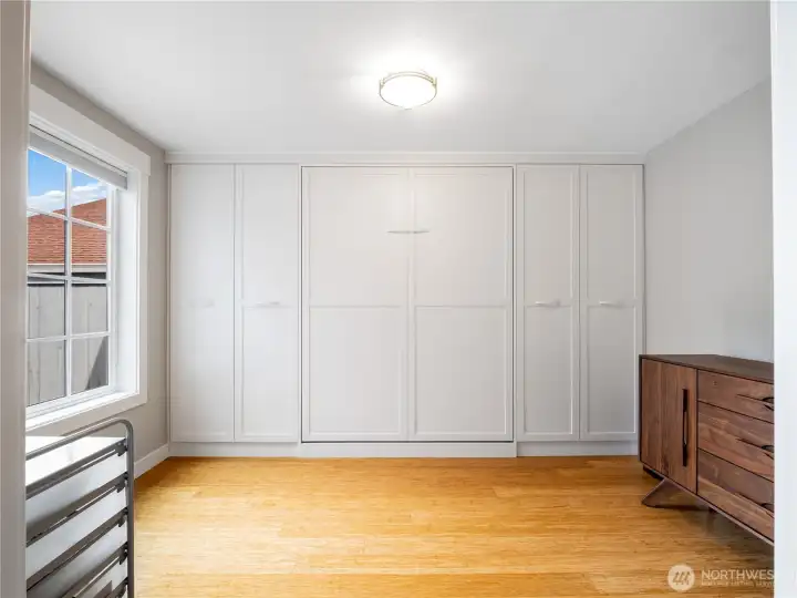 When the built in murphy bed is not in use, this could be an office or a craft/music room.