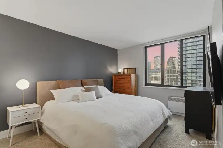 One of two spacious bedrooms with city views and fantastic light. One of two spacious bedrooms with city views and fantastic light.