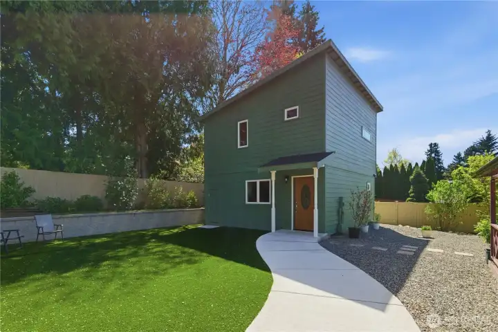 High quality artificial turf and walkway in back. yard leads to DADU