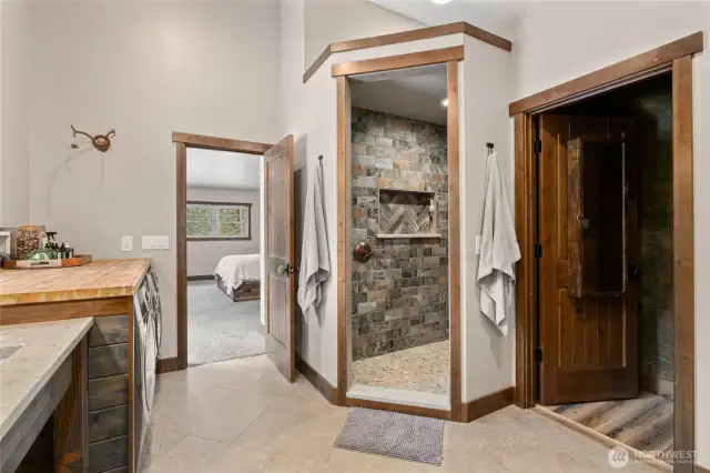 Large primary bathroom with walk in shower and large walk in closet.