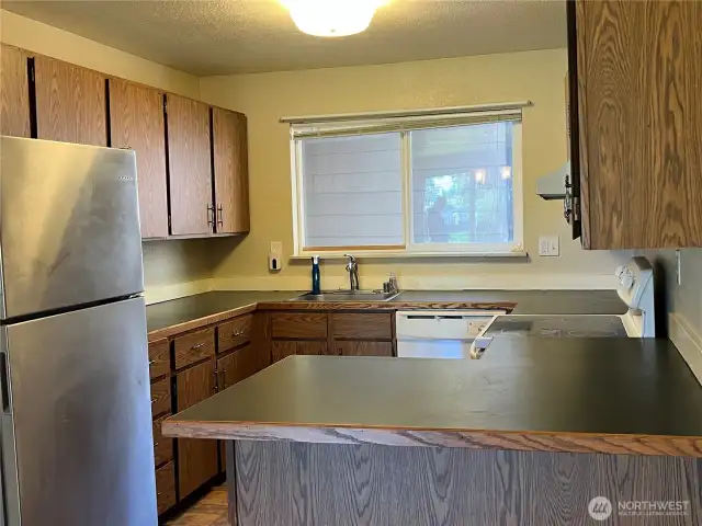 The kitchen with plenty of counterspace and cupboards.