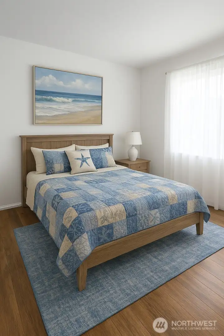 Virtually staged 1st bedroom. Current flooring.