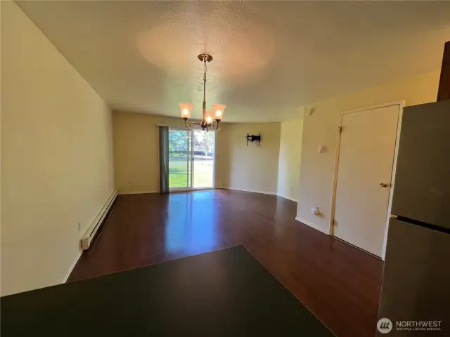 Overview of the dining room open to the living room.