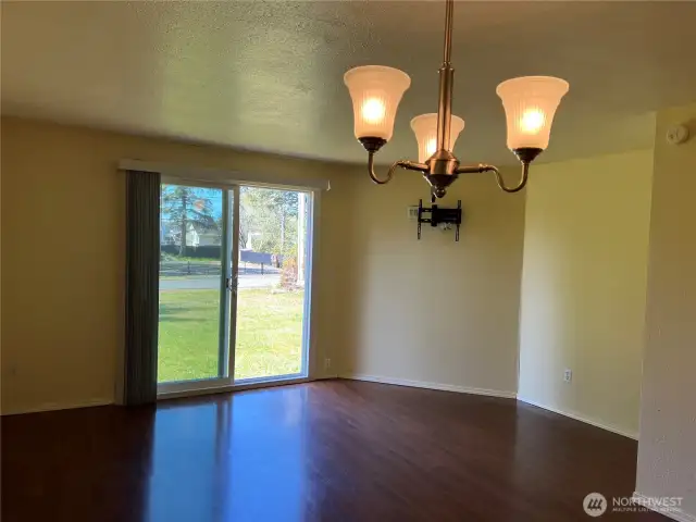 Good sized living room open to the dining room and the kitchen. nice view out the slider to the back yard.
