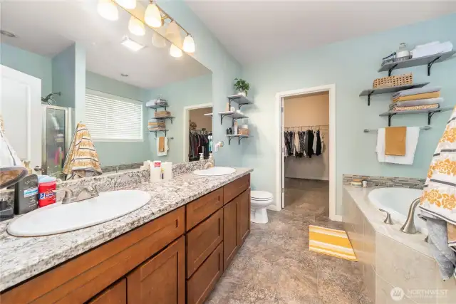 5 piece master bath with granite counters, oversized soaking tub and walk in closet.
