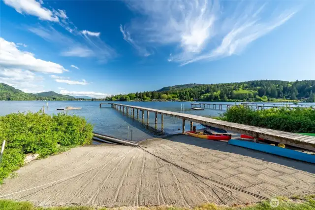 Another view of the well-maintained community beach with some of the residents kayaks and canoes.
