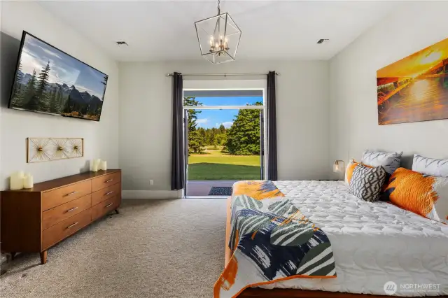 French doors with views of the countryside off the primary bedroom.