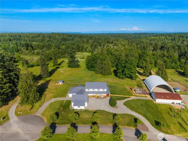 Aerial View of the 5+ acre lot. Does not include riding area and barn.