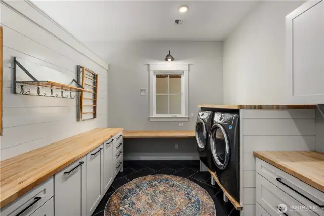 Counter space for folding cloths and built in laundry bins. One of two laundry rooms! Washer and dryers included.