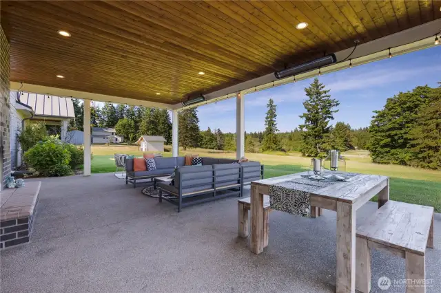 Spacious back patio with built in heaters and outdoor fireplace for year round enjoyment.