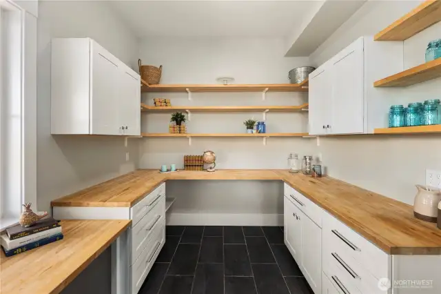 Generous pantry off the kitchen with an entrance from the south facing porch.