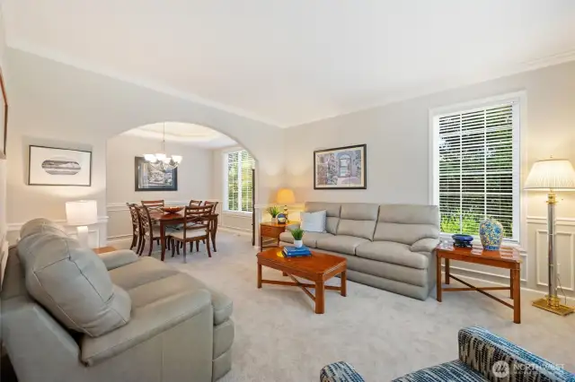 When you walk into the entry, to the right is a lovely living room with dining area beyond.
