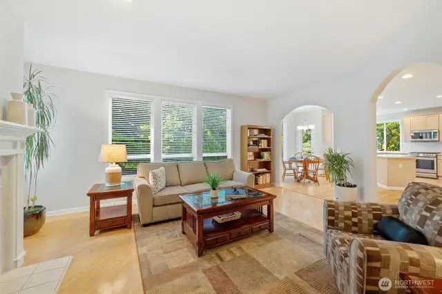 Informal great room with windows and private living off huge kitchen and eating area dinette. Door to back yard and large deck is too.