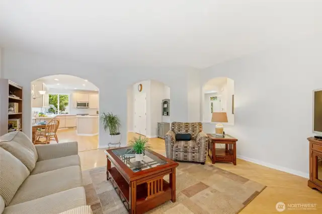 Spacious and lovely great room with kitchen eating area beyond.
