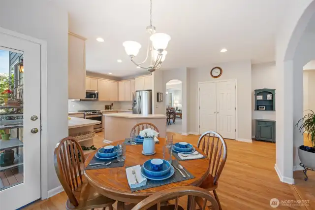 More of the informal dinette, deck door and kitchen space and beyond is the dining room and formal living area.