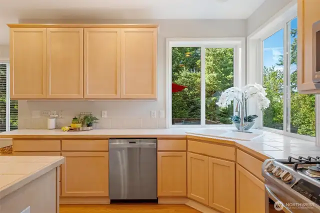 Corner windows over the sink allows massive light to the large oversized kitchen.