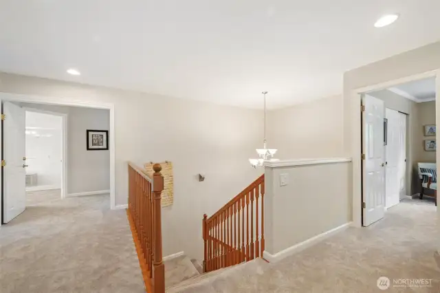 Balcony looking over to primary bedroom suite and to the right is the 3rd bedroom. Fantastic upper floor design.