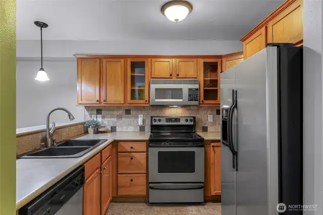 Efficient kitchen layout with stainless steel appliances.