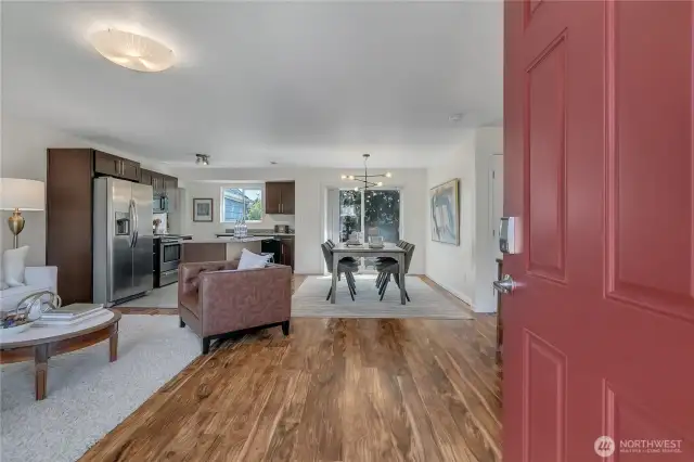 Walk into the open living area, so much room for seating. Tons of light with the floor to ceiling windows in the front and the slider off the dining area.